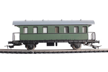 Obraz premium Model of a steam locomotive and cistern on rails on a white background
