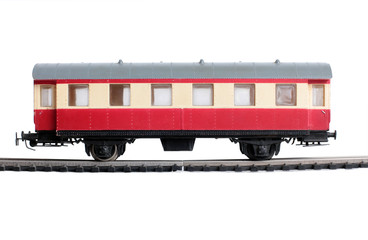 Fototapeta premium Model of a steam locomotive and cistern on rails on a white background