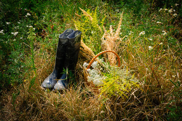 Black boots near the flea market with grasses below