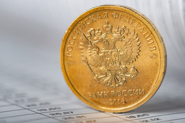 One ruble coin on a summary table