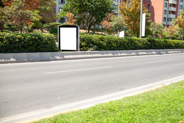 advertising board on asphalt road