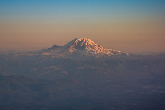 View on Mount Rainier from airplane window during a flight