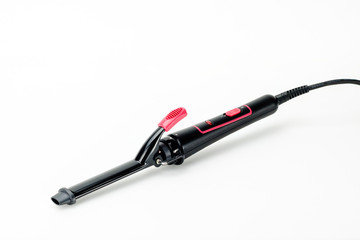 Hair iron on white mat background with copy space