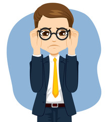 Young man suffering visual impairment problem adjusting glasses on face