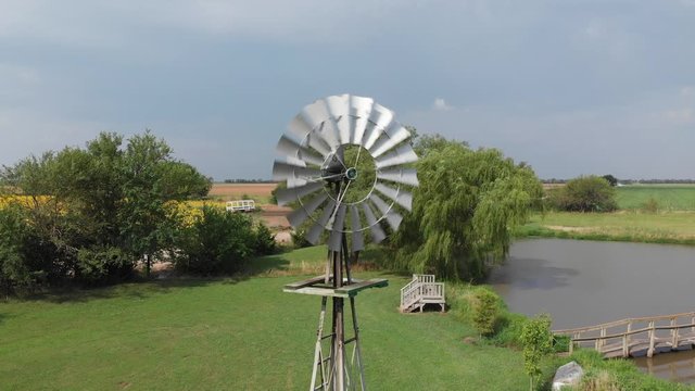 windmill spinning on a windy day