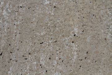 Natural stone backgrounds on the wall and sidewalk.
