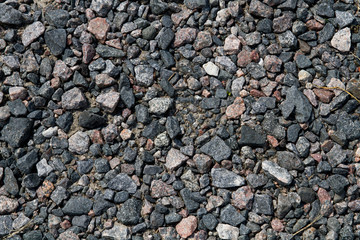 Natural stone backgrounds on the wall and sidewalk.