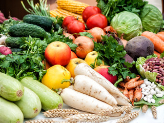 Many different vegetables lie on the table.