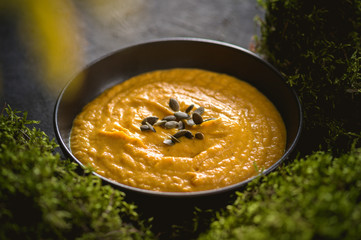 Pumpkin cream soup with cream and pumpkin seeds