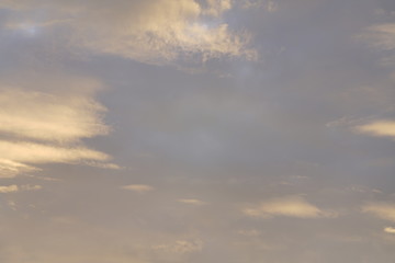 Fototapeta na wymiar Cloudy orange sky at evening