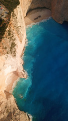 Aerial drone view of iconic beach of Navagio or Shipwreck voted one of the most beautiful beaches...