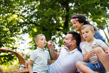 Family picnic outdoors togetherness relaxation happiness concept