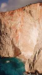Aerial drone view of iconic beach of Navagio or Shipwreck voted one of the most beautiful beaches in the world with deep turquoise clear sea, Zakynthos island, Ionian, Greece