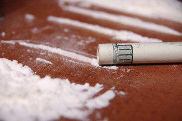cocaine on the table (white powder)