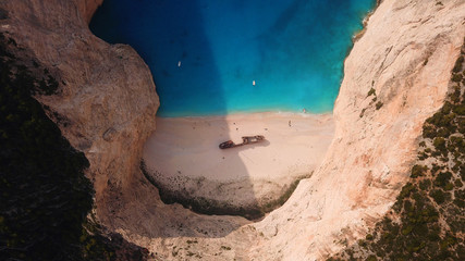 Aerial drone view of iconic beach of Navagio or Shipwreck voted one of the most beautiful beaches in the world with deep turquoise clear sea, Zakynthos island, Ionian, Greece