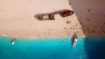 Aerial drone view of iconic beach of Navagio or Shipwreck voted one of the most beautiful beaches in the world with deep turquoise clear sea, Zakynthos island, Ionian, Greece