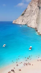 Papier Peint photo Plage de Navagio, Zakynthos, Grèce Aerial drone view of iconic beach of Navagio or Shipwreck voted one of the most beautiful beaches in the world with deep turquoise clear sea, Zakynthos island, Ionian, Greece
