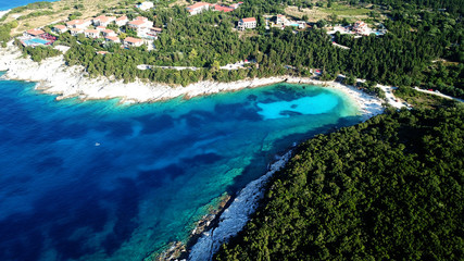 Aerial drone photo of tropical caribbean bay with white sand beach and beautiful turquoise and sapphire clear sea