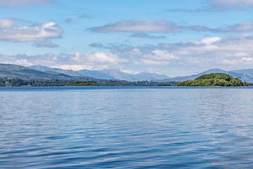 Lough Corrib with forest and Conerama mountains in background
