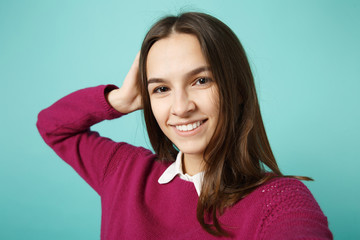 Fototapeta premium Close up young brunette woman girl in casual clothes posing doing selfie shot on mobile phone isolated on blue background studio portrait. People sincere emotions lifestyle concept. Mock up copy space