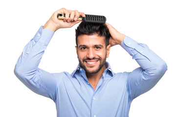 Man brushing his hair