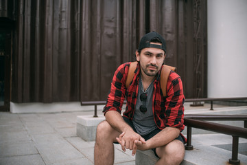 Portrait of a young man on a urban background