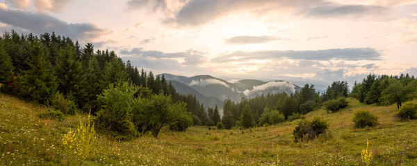 Amazing mountain landscape with colorful vivid sunset.