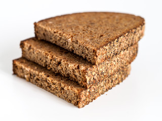 Sliced black bread on white background.