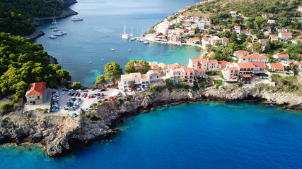 Aerial drone bird's eye view photo of beautiful and picturesque colorful traditional fishing village of Assos in island of Cefalonia, Ionian, Greece