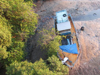 Fishing vessel on the Ceara River, with low water level, caused by seasonal drought in northeastern Brazil.