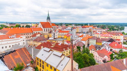 Fototapeta na wymiar Jindrichuv Hradec cityscape with Church of the Assumption of the Virgin Mary, Czech Republic. Aerial view from Black Tower of Jindrichuv Hradec Castle