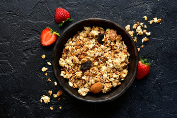 Homemade multicereal granola with fresh strawberry. Top view with copy space.