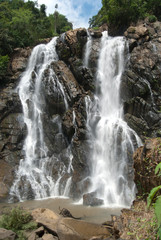 beautiful waterfall with trees and sky