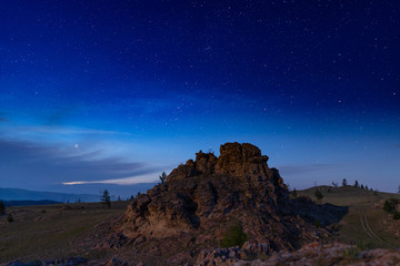 Fototapeta na wymiar Russia, Lake Baikal, Clouds and Stars Valley of Spirits