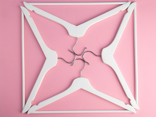 White hangers. Flat lay. Hangers background. Hangers pattern