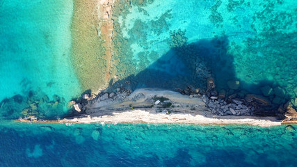 Aerial drone photo of iconic white rock cliffs and volcanic formations near famous beach of Platys and Makrys gialos with turquoise clear sea, Argostoli, Cefalonia island, Ionian, Greece