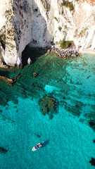 Aerial drone photo of tropical caribbean turquoise bay with large volcanic white cliffs and beautiful emerald sea