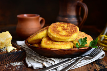 Fried potato patties with cheese.