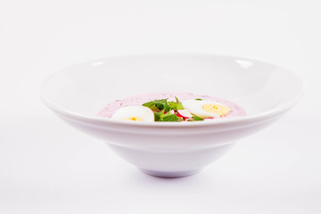 Cold borscht (chlodnik) - traditional Lithuanian cold soup with radish, parsley, dill and egg