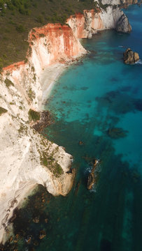 Aerial drone photo of iconic white rock cliffs and volcanic formations near famous beach of Platys and Makrys gialos with turquoise clear sea, Argostoli, Cefalonia island, Ionian, Greece © aerial-drone