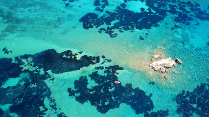 Aerial drone photo of famous white caves and sandy beach in small island of Marathonisi and beautiful turquoise seascape, Zakynthos island, Ionian, Greece