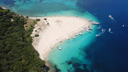 Aerial drone photo of famous white caves and sandy beach in small island of Marathonisi and beautiful turquoise seascape, Zakynthos island, Ionian, Greece