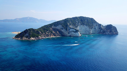 Aerial drone photo of famous white caves and sandy beach in small island of Marathonisi and beautiful turquoise seascape, Zakynthos island, Ionian, Greece