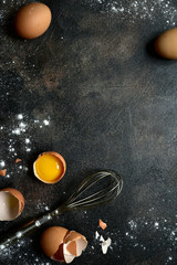 Culinary background with ingredients for baking : milk, butter,sugar, dough and egg . Top view with...