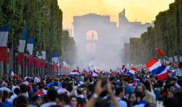 PARIS, France – July 15, 2018 : thousands of jubilant french fans on the Avenue des Champs-Élysées celebrating France's victory over Croatia in the 2018 FIFA World Cup Final.