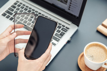 Woman's hands hold smartphone and its silicone case
