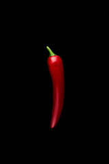 Seamless pattern with red hot chili peppers. Vegetables abstract background. Food collage, slicing hot red chili peppers Red hot chili peppers on a black background.