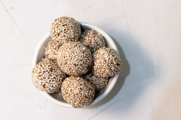 Homemade sweets energy balls made from superfoods like seeds, nuts and dried fruits. Healthy snack, raw dessert and superfood. With space for text