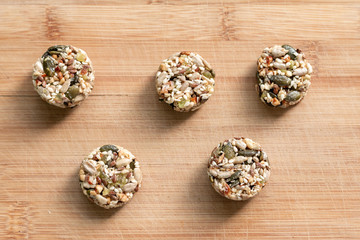 Homemade sweets energy balls made from superfoods like seeds, nuts and dried fruits. Healthy snack, raw dessert and superfood. With space for text