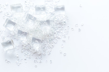 Frozen water in ice cubes on white bar table top view mockup